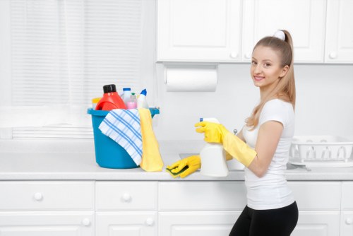 Local cleaner preparing a kitchen and bathroom for new Airbnb guests